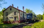 PAR 7552 leads a joint Pan Am / CSX inspectnon train past the former Boston & Maine depot in South Kingston, NH